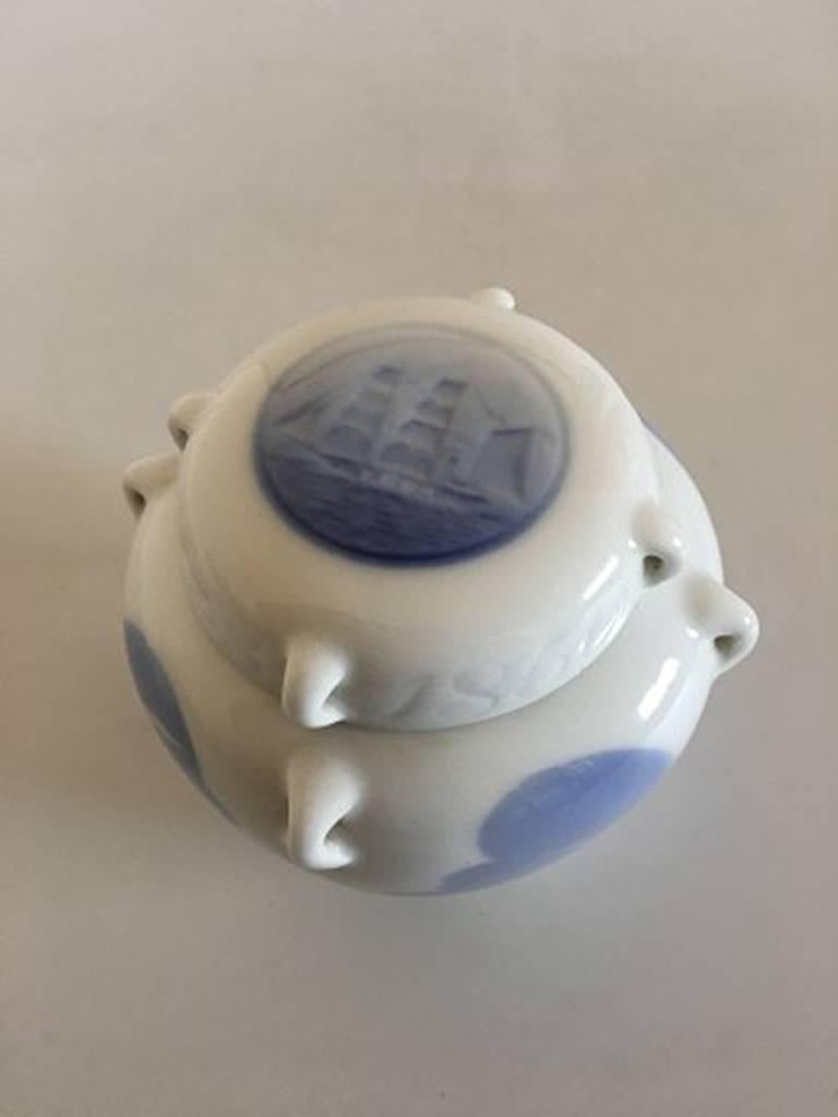Royal Copenhagen lidded jar with seagull and ship motif and tiny handles. 1st quality in nice and whole condition. Measures 10 cm H (3 15/16 in).