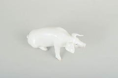 Royal Copenhagen. Naturalistic figure of a pig in white-glazed porcelain. 1910s.