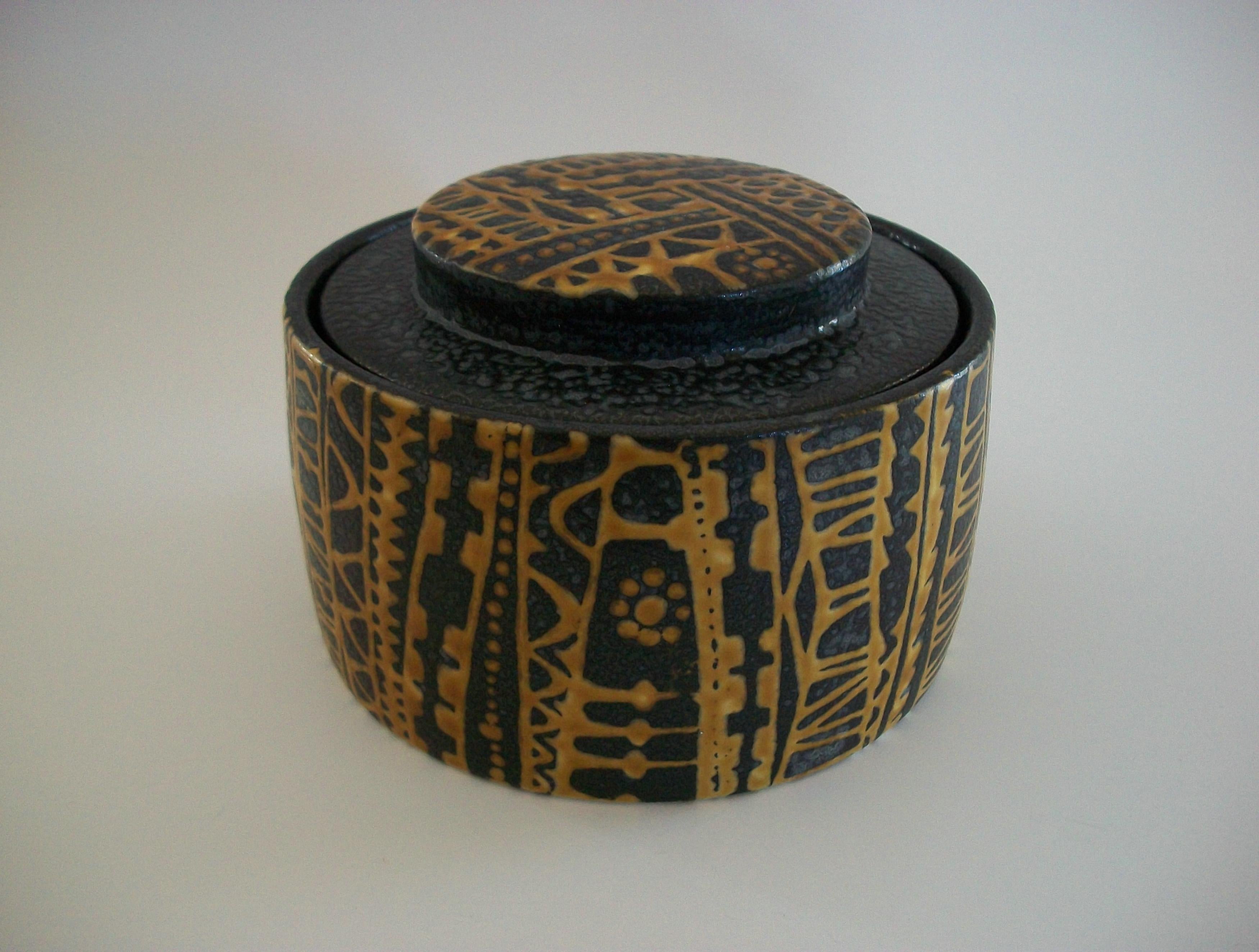 ROYAL COPENHAGEN (Manufacturer) - NILS THORSSON (Designer) - Mid Century fajance lidded jar (tobacco jar) - featuring a yellow and brown abstract pattern over-all with yellow glazed interior and base - brown glazed rim and lid edge - textured finish