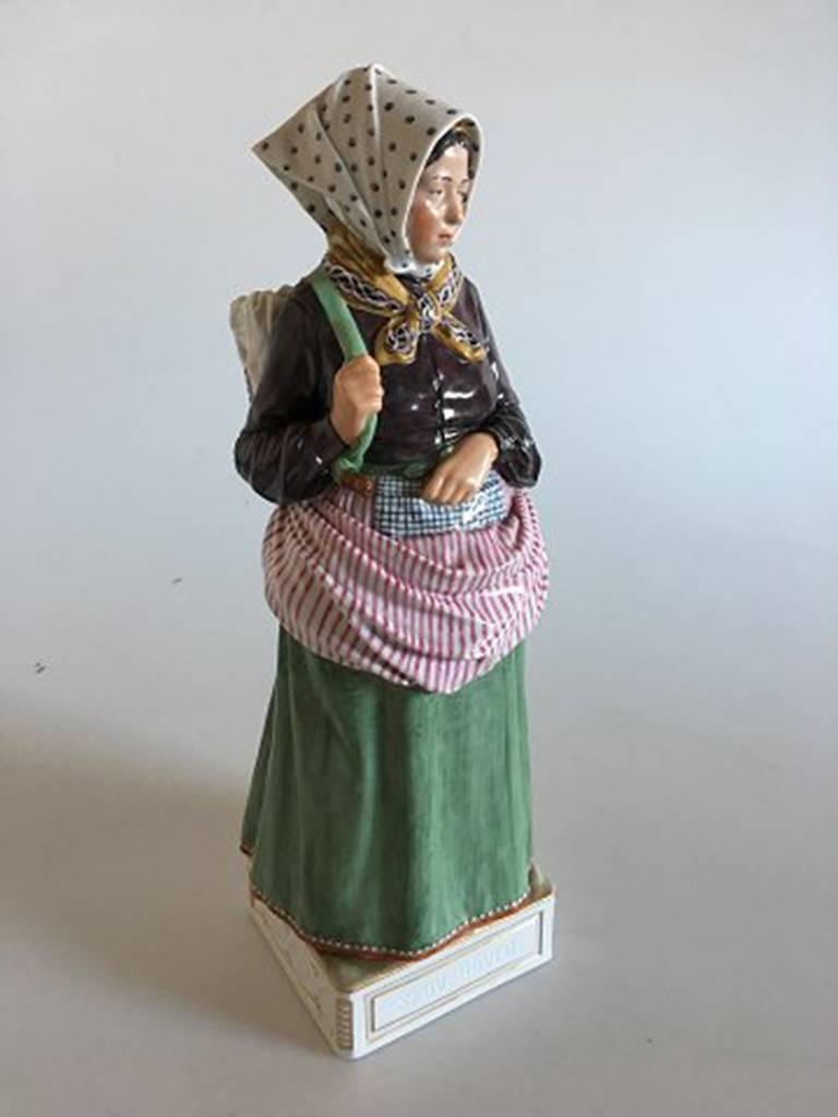 Royal Copenhagen over-glaze figurine skovshoved girl #12171. In perfect condition and measures 31 cm.