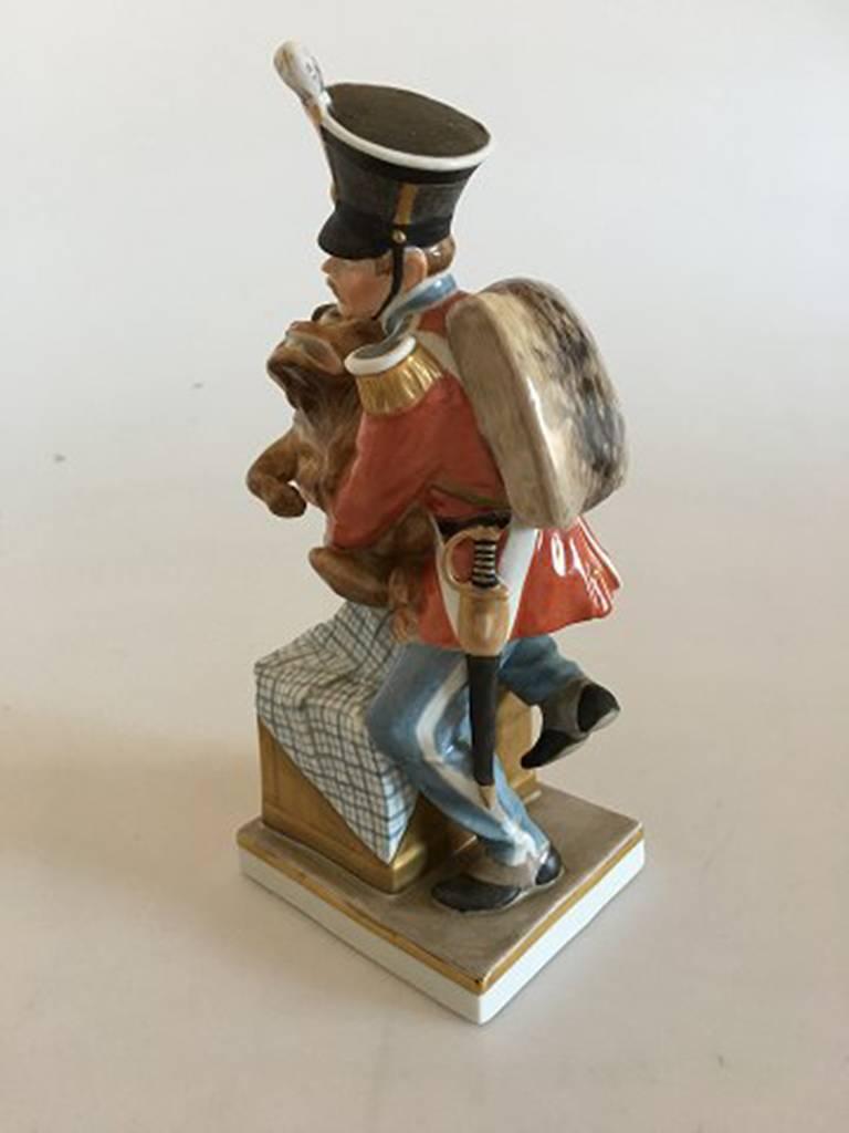 Royal Copenhagen over glaze figurine soldier with dog tinderbox #1156. Measures 18cm and is in good condition. Designed by Christian Thomsen.