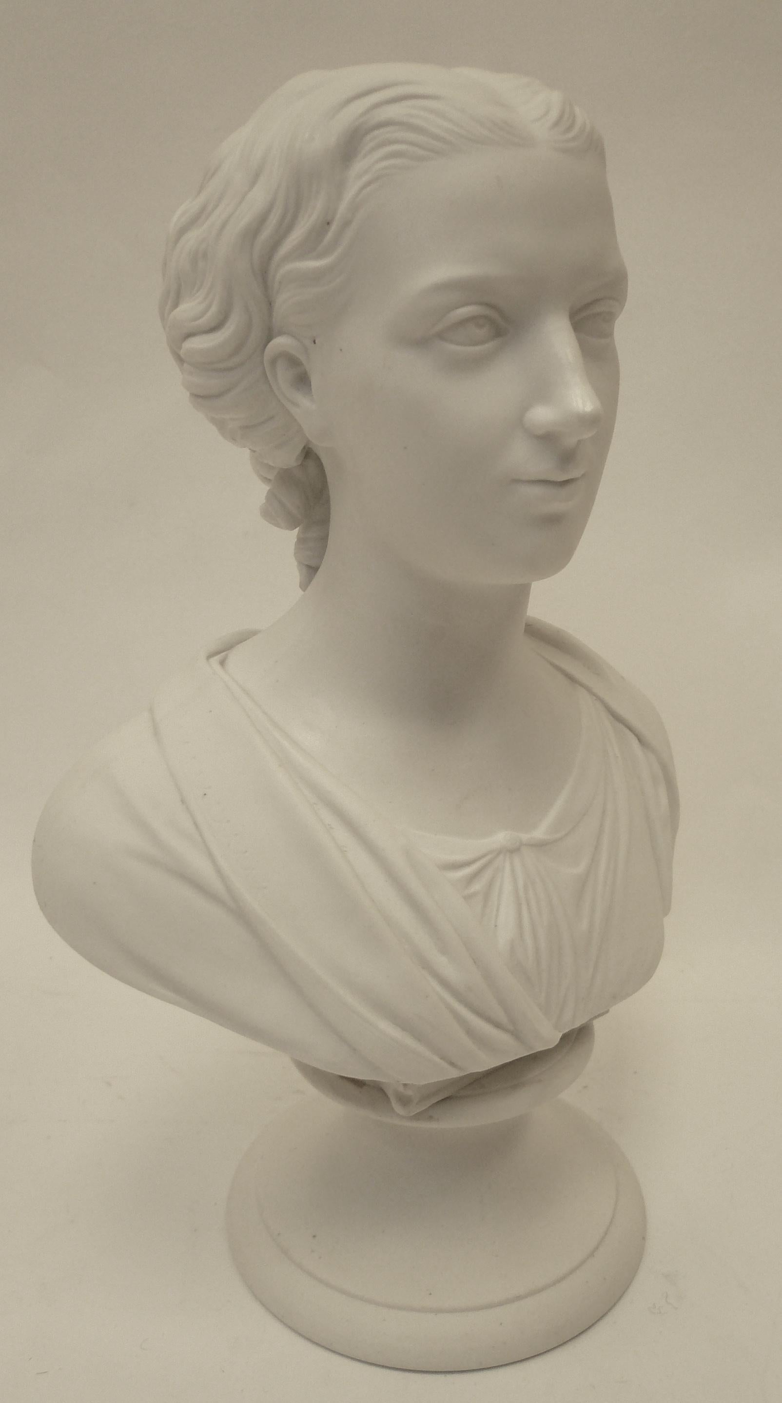 This finely detailed parian porcelain bust of Eneret is artist signed and dated.