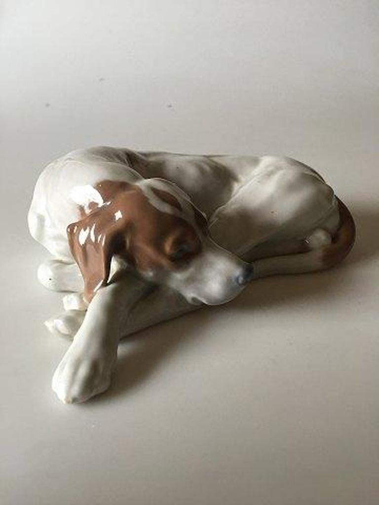 Royal Copenhagen pointer head down figurine No 1634. 

Measures 20 cm x 6 cm / 7 7/8