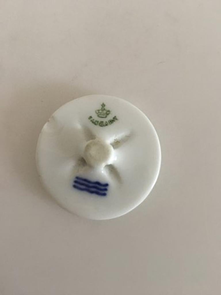 Royal Copenhagen Porcelain Button with Handpainted Flower Motif. 3 cm dia. Has a chip on the back.
