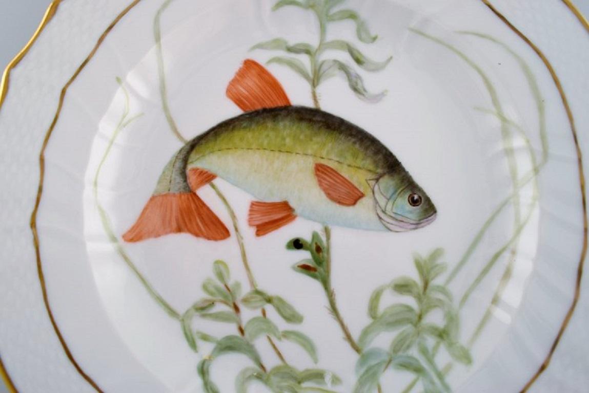 Royal Copenhagen porcelain dinner plate with hand-painted fish motif and golden border. Flora / Fauna Danica style. Dated 1951.
Diameter: 25.5 cm.
In excellent condition.
Stamped.
3rd factory quality.