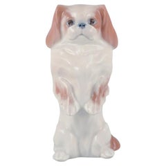 Royal Copenhagen, porcelain figure of a standing Pekingese dog. 