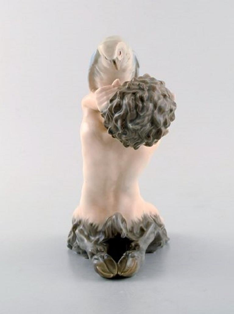 Mid-20th Century Royal Copenhagen Porcelain Figurine, Faun with Parrot, Model Number 752
