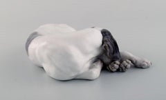 Royal Copenhagen Porzellan-Figur. Liegender Zeiger. 1920's.