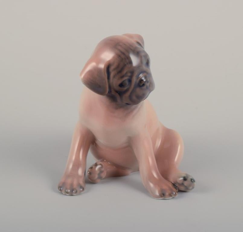 Danish Royal Copenhagen, porcelain figurine of a Boxer puppy. Ca 1930s For Sale