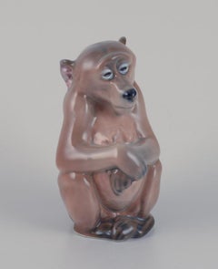Royal Copenhagen. Porcelain figurine of a monkey. Designed by Niels Nielsen.