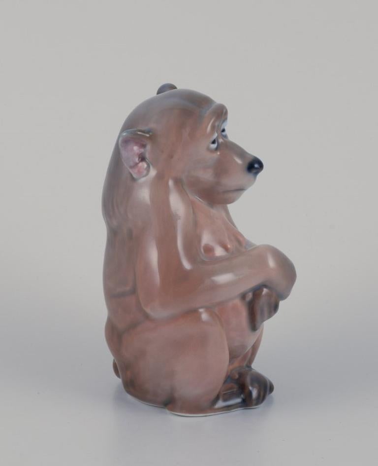Danish Royal Copenhagen. Porcelain figurine of a monkey. Designed by Niels Nielsen. For Sale