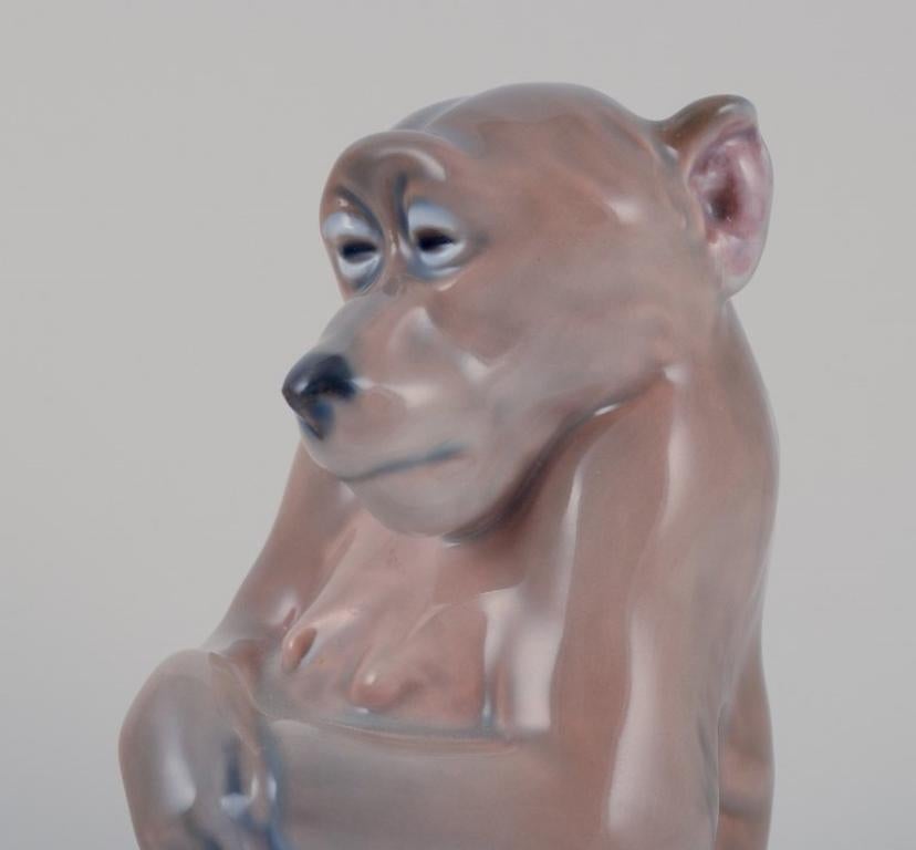 Royal Copenhagen. Porcelain figurine of a monkey. Designed by Niels Nielsen. For Sale 2