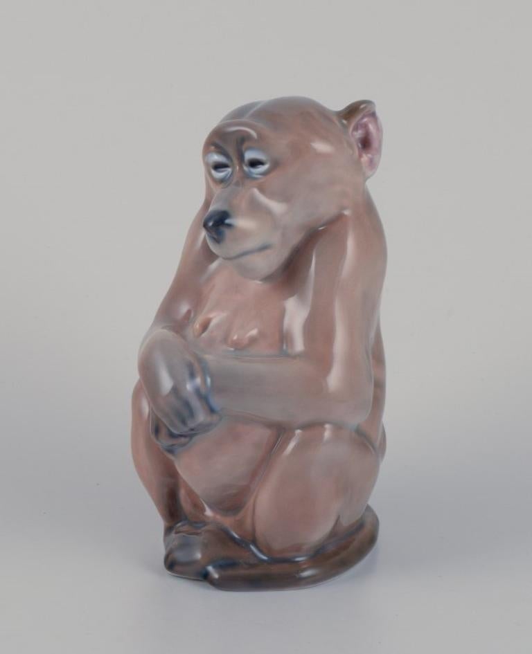 Royal Copenhagen. Porcelain figurine of a monkey. Designed by Niels Nielsen. For Sale 3