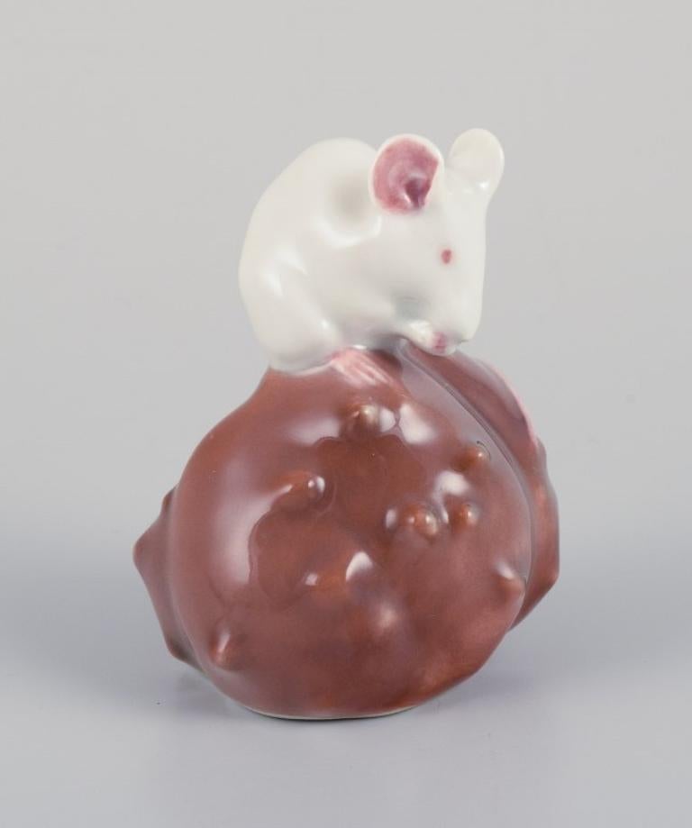 Danish Royal Copenhagen. Porcelain figurine of a mouse on a chestnut. For Sale