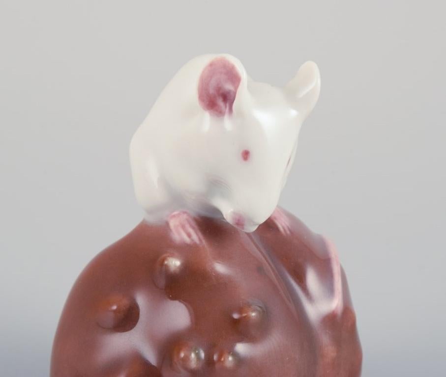 Early 20th Century Royal Copenhagen. Porcelain figurine of a mouse on a chestnut. For Sale