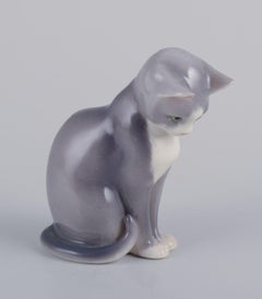 Royal Copenhagen. Porcelain figurine of a sitting cat. 21st C.