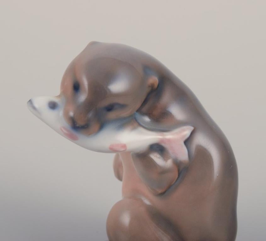 Danish Royal Copenhagen, porcelain figurine of an otter with a fish in its mouth