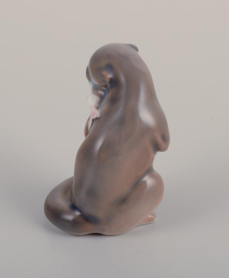 Mid-20th Century Royal Copenhagen, porcelain figurine of an otter with a fish in its mouth