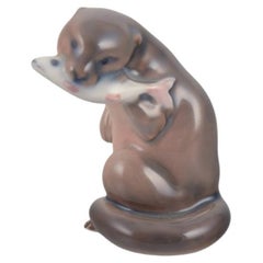 Royal Copenhagen, porcelain figurine of an otter with a fish in its mouth