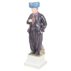 Royal Copenhagen. Porcelain figurine of man in traditional regional costume.