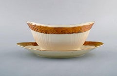 Royal Copenhagen Porcelain Sauce Boat with Floral Motifs and Gold Border