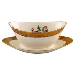 Vintage Royal Copenhagen Porcelain Sauce Boat with Floral Motifs and Gold Border