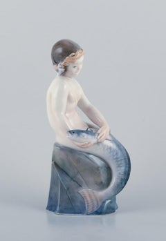 Royal Copenhagen, rare porcelain figurine of a mermaid with fish in her hands