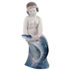 Vintage Royal Copenhagen, rare porcelain figurine of a mermaid with fish in her hands