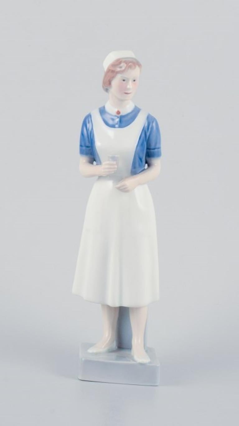 Royal Copenhagen, rare porcelain figurine of a nurse.
Model: 4507/156.
In perfect condition.
First factory quality.
Marked.
Dimensions: H 21.5 cm x D 6.5 cm.