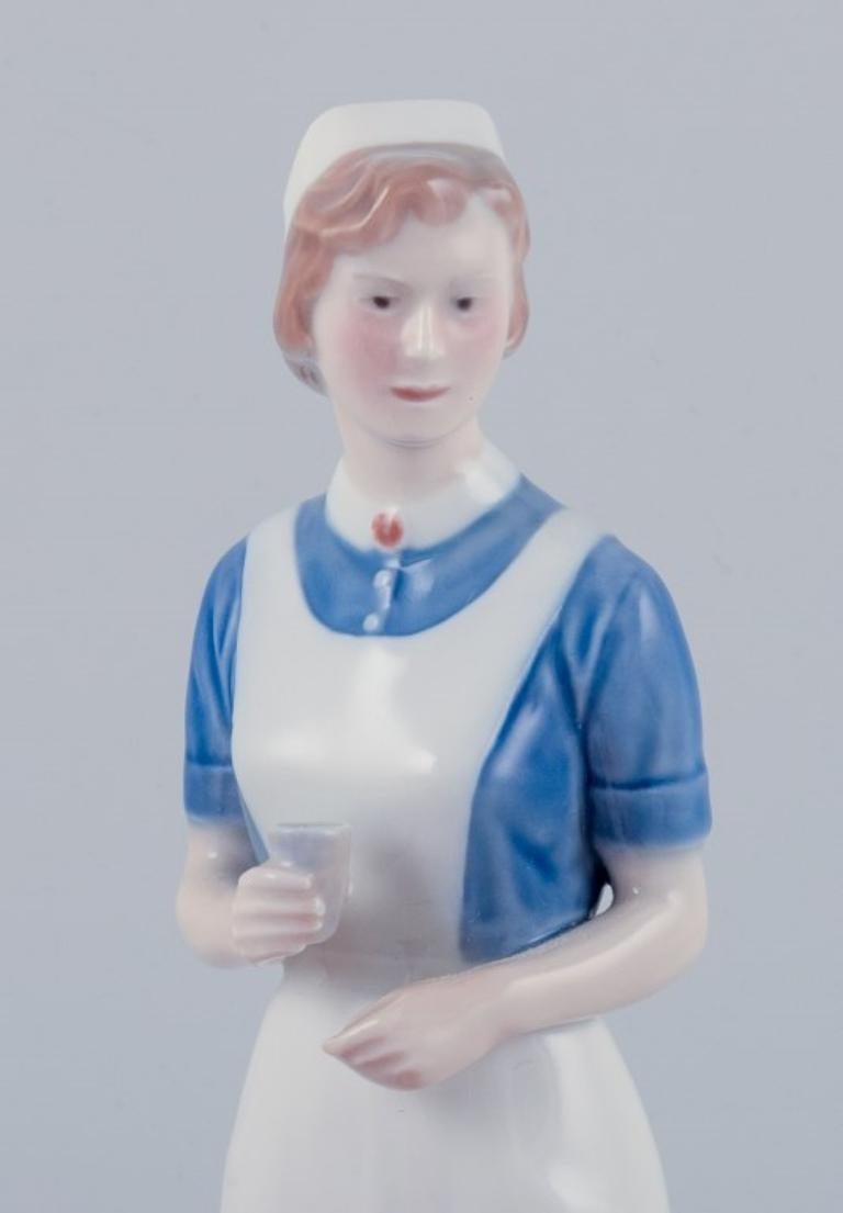 Danish Royal Copenhagen, rare porcelain figurine of a nurse. Model: 4507/156.  For Sale
