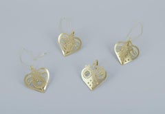 Royal Copenhagen "Royal Christmas". Nine brass Christmas ornaments, 21st C.