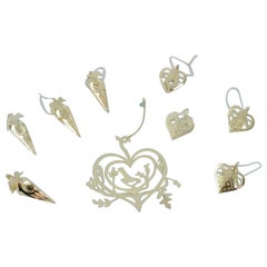 Royal Copenhagen "Royal Christmas". Nove ornamenti natalizi in ottone, XXI secolo.