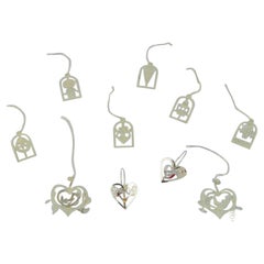 Royal Copenhagen "Royal Christmas". Set di dieci ornamenti natalizi in ottone.