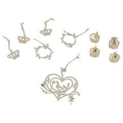 Royal Copenhagen "Royal Christmas". Set di dieci ornamenti natalizi in ottone.