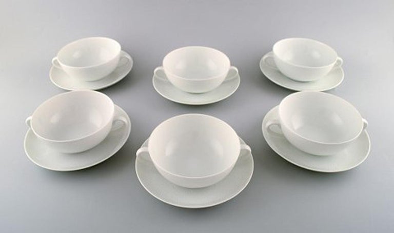Royal Copenhagen Salto service, white.
Set of 6 boullion cups with saucers.
The cup measures: 13.5 x 5.5 cm. 
The saucer measures: 15.5 cm.
In very good condition.
2nd factory quality.