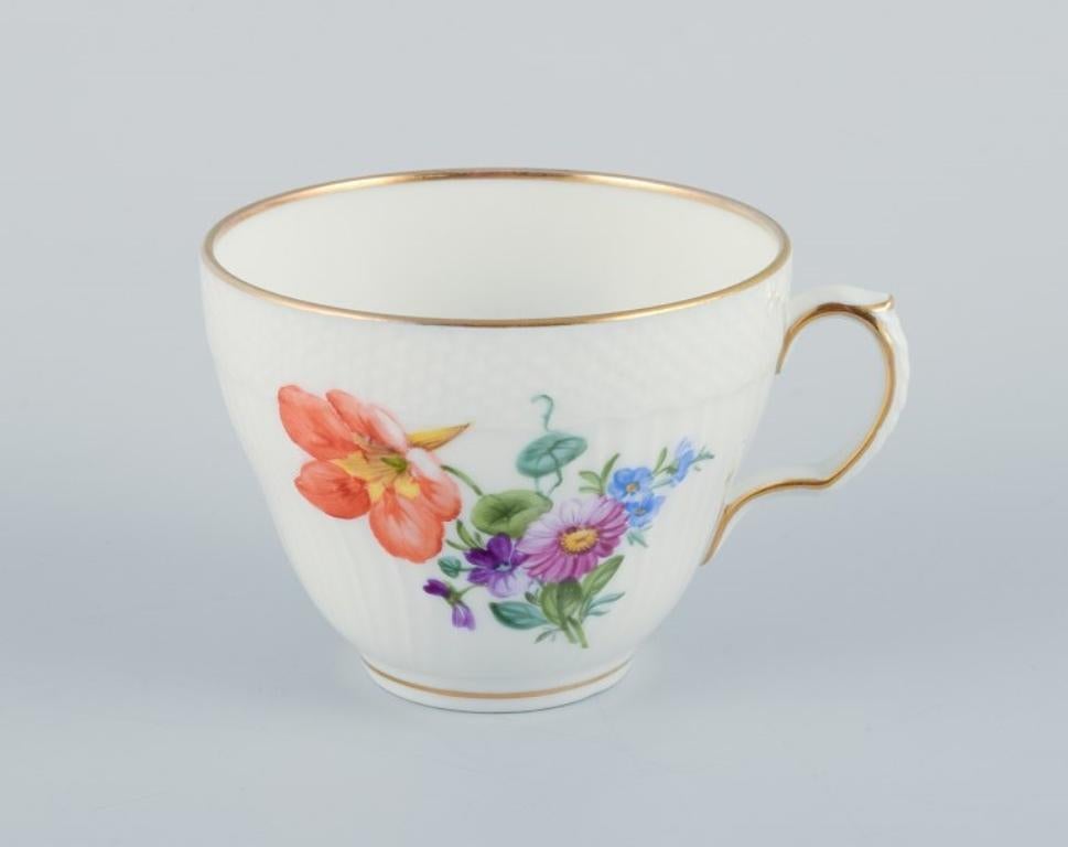 Royal Copenhagen, Saxon Flower, a set of four coffee cups with saucers, hand-decorated with polychrome flowers and gold rim.
Dating approx. 1930.
Model number: 493/1549.
Marked.
First factory quality.
In perfect condition.
Cup: Diameter 7.5 cm