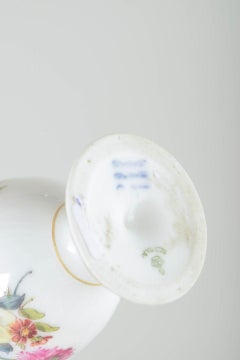 Royal Copenhagen Saxon Flower. Three porcelain egg cups, two with fixed saucers.