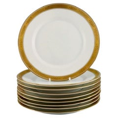 Royal Copenhagen Service n° 607. Neuf assiettes de déjeuner en porcelaine, datées de 1946