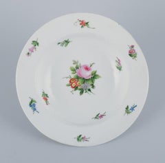 Royal Copenhagen, set of four rare and antique Saxon Flower porcelain plates.