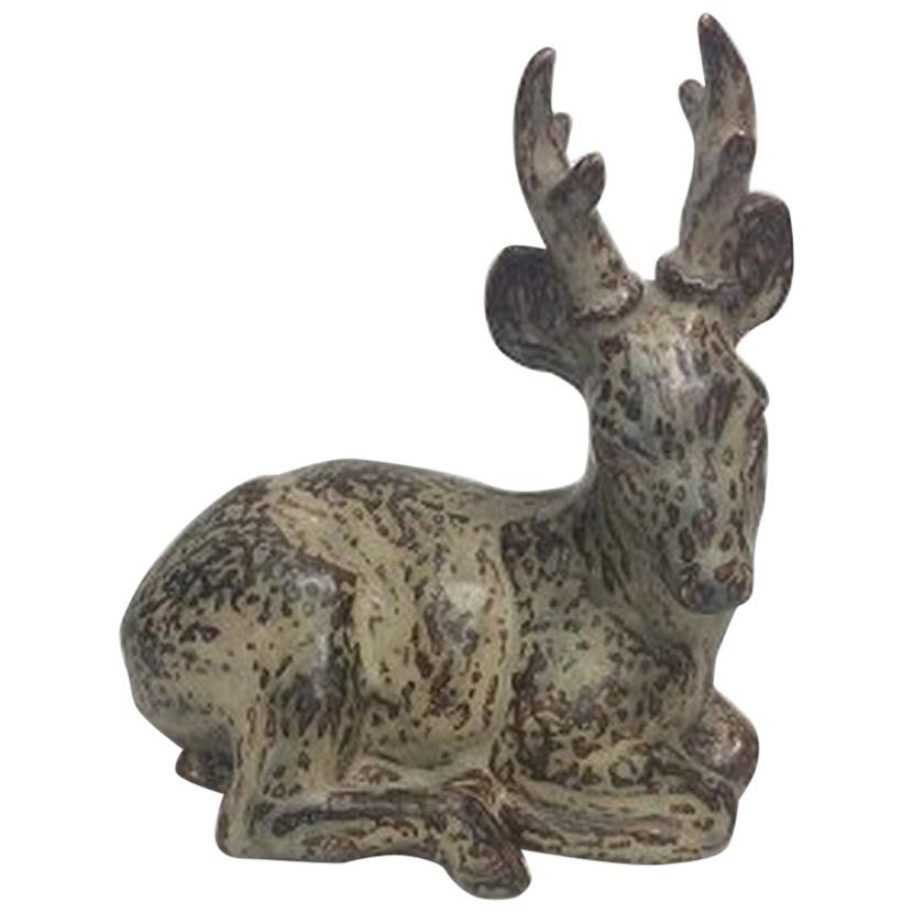 Royal Copenhagen Stoneware figurine of deer no 20507.

1st quality and designed by Knud Kyhn.

Measures 29cm x 24cm (11.42