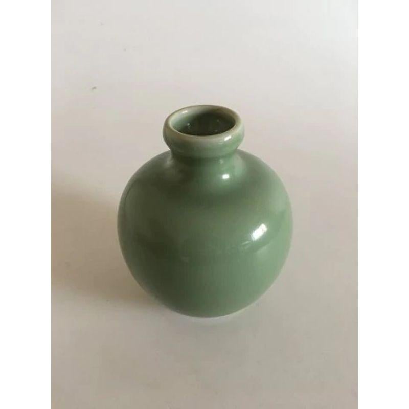 Royal Copenhagen Stoneware Vase in Celedon Glaze 1/3229

Measures 14cm and is in good condition.