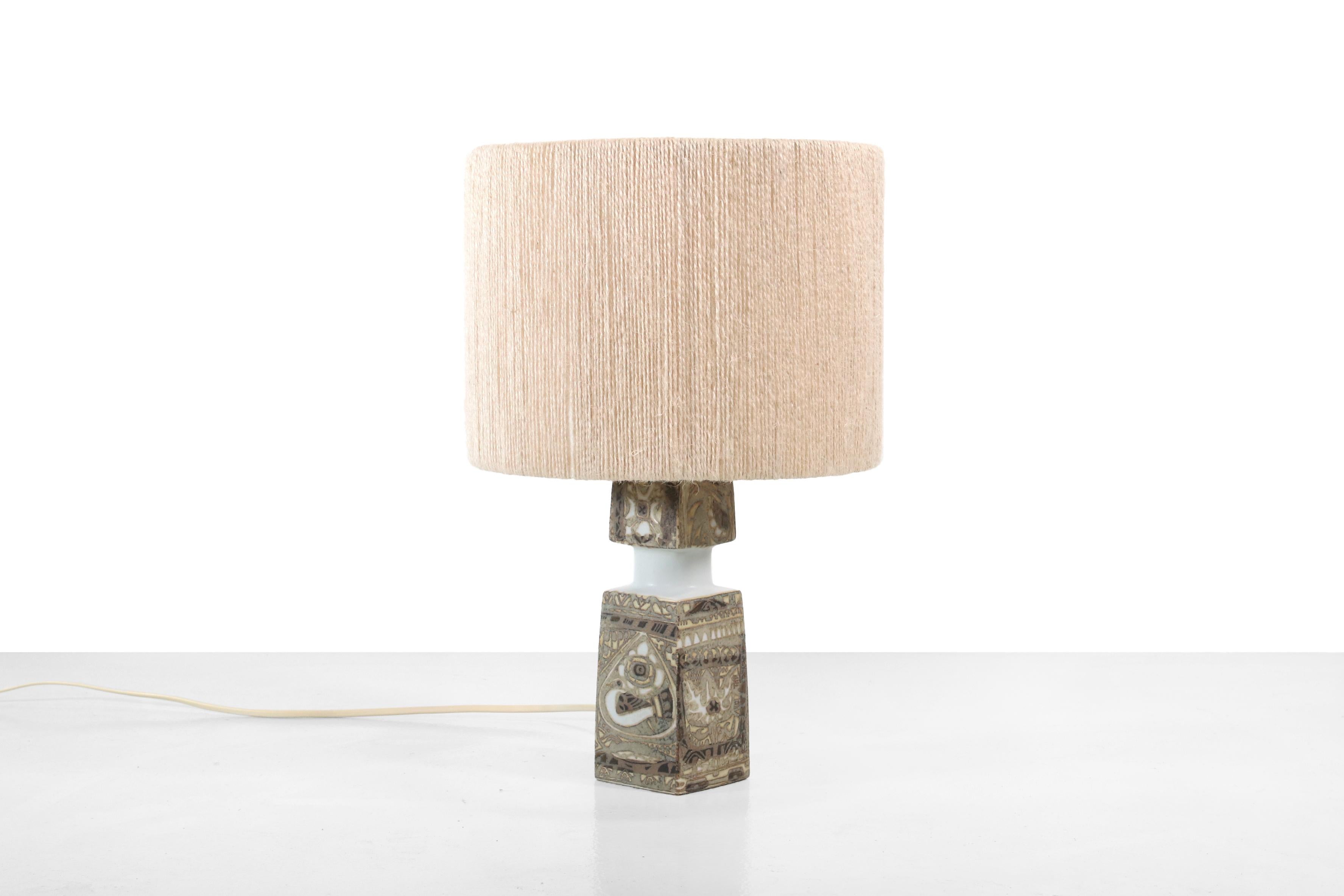 Beautiful ceramic Royal Copenhagen table lamp by Nils Thorsson for Fog & Mørup. This lamp has the model name BACA III and is a wonderful collaboration between a designer, ceramic producer and a lamp factory. A functional art object. The shade is