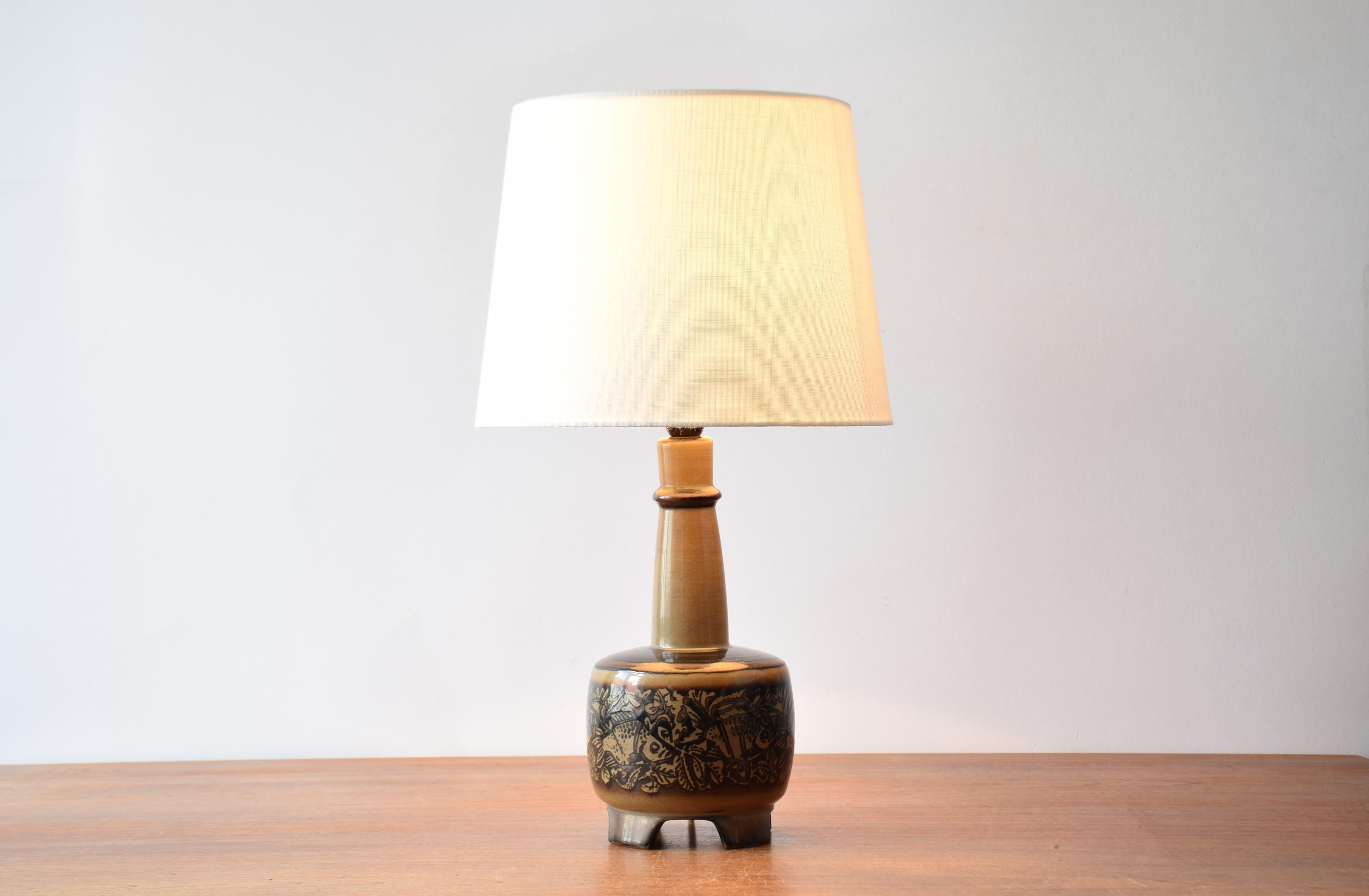 Vintage Danish table lamp designed by Nils Thorsson for Royal Copenhagen in cooperation with Fog & Mørup.
The lamp features a fish motif around the base.

Made circa 1960s or 1970s.

The lamp is marked both with the Royal Copenhagen 3 waves