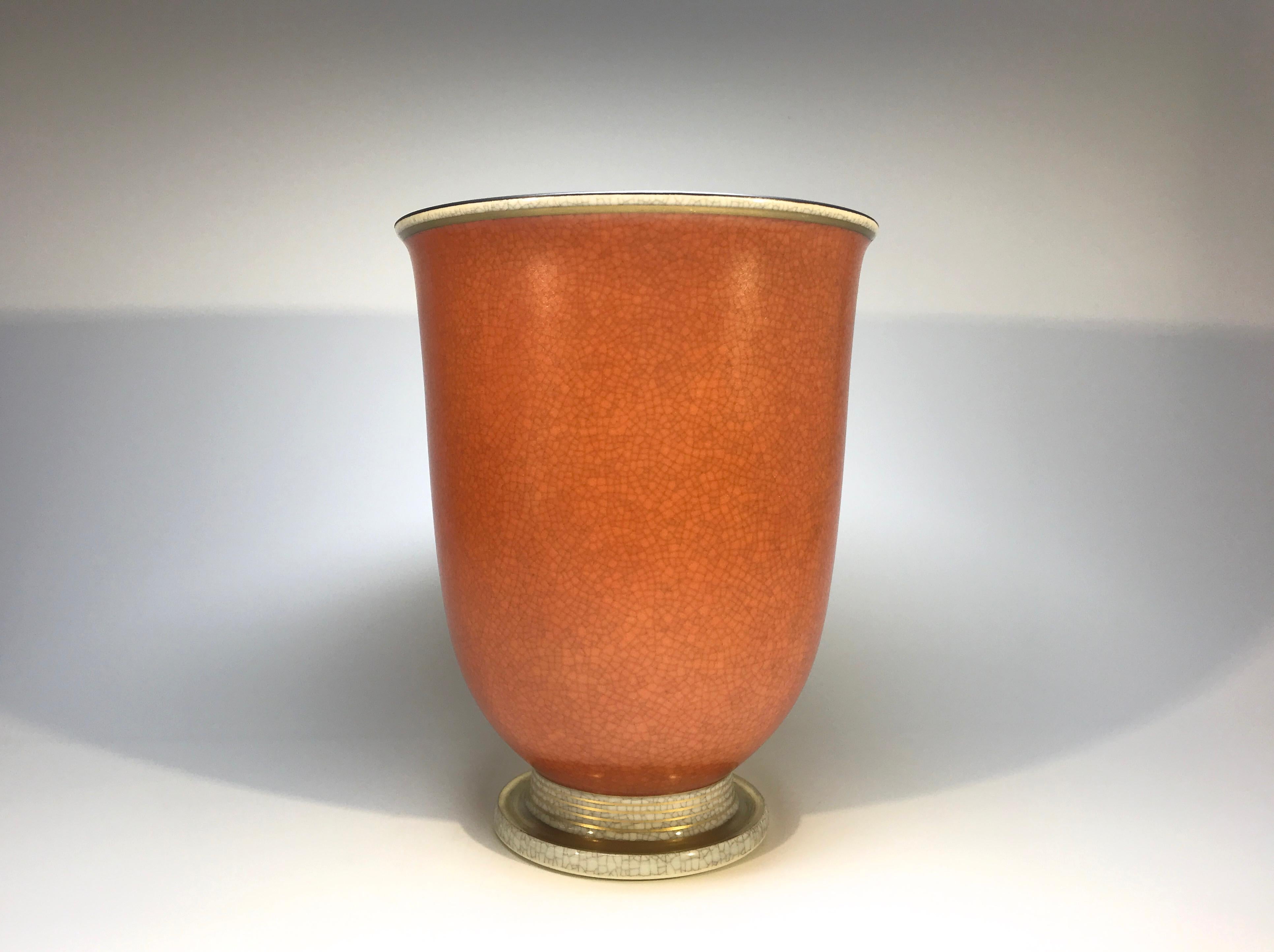 Graceful Royal Copenhagen porcelain terracotta and grey crackle glazed vase with gilded banding on base.
A discerning collectors piece
circa 1969-1973
Stamped and numbered 2731
Measures: Height 6 inch, diameter 4.75 inch
In excellent