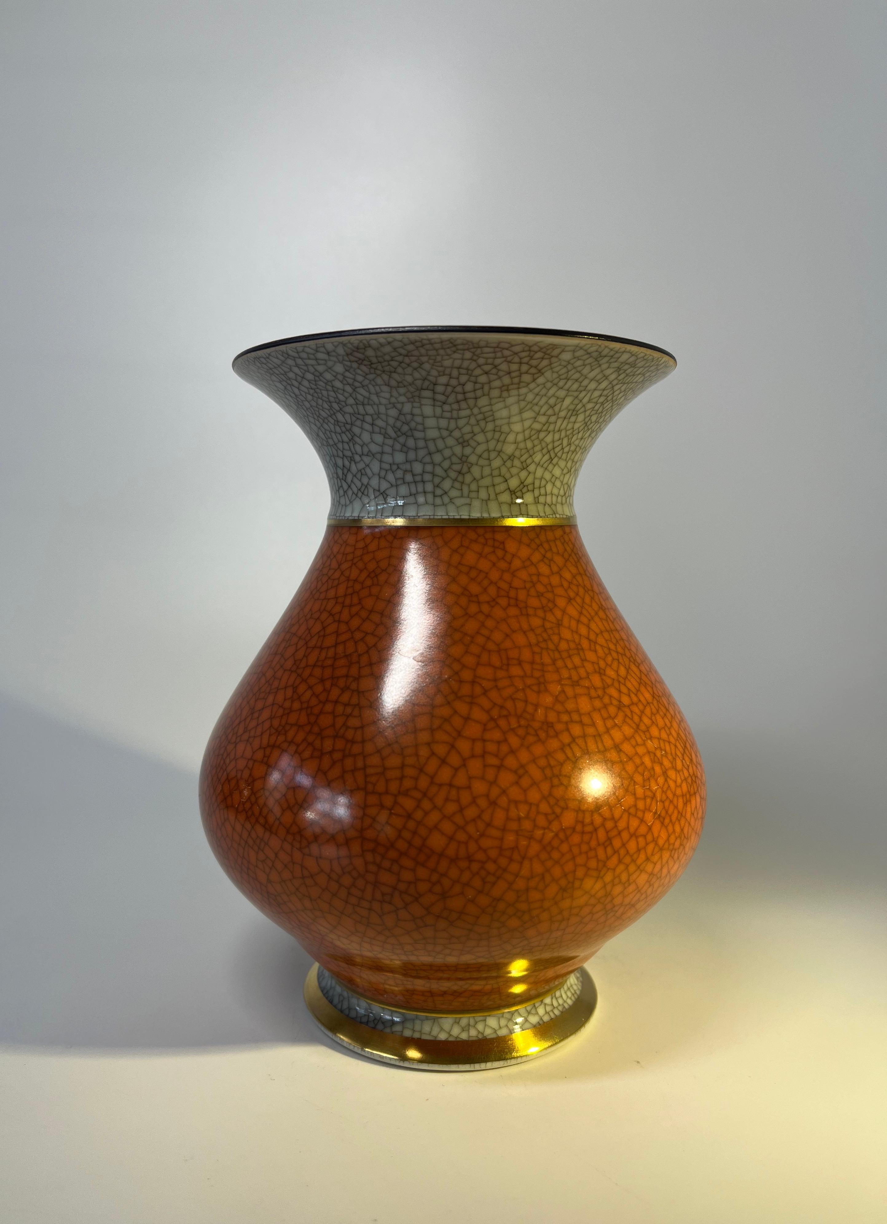 Royal Copenhagen porcelain gilded terracotta and grey crackle glazed baluster vase. 
A premium quality vase with a matt glaze to the terracotta porcelain.
Circa 1954.
Stamped and numbered 3060.
Measures: height 6.25 inch, diameter 5