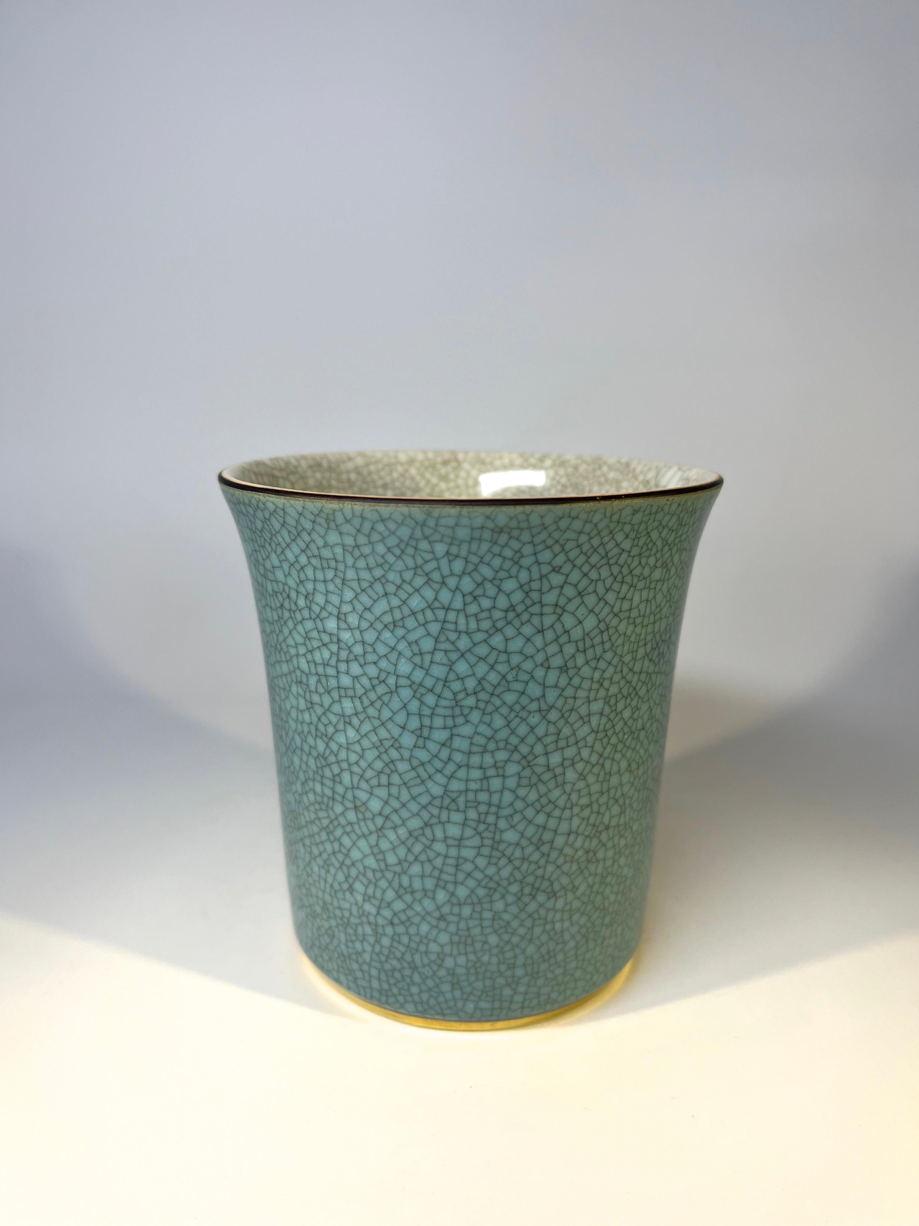 Thorkild Olsen for Royal Copenhagen, Denmark, porcelain crackle glaze tumbler pot
Turquoise crackle glaze with gilded band to base. Pale grey crackle interior
Circa 1963
Stamped and numbered 3613
Height 4 inch, Diameter 3.5 inch
In very good