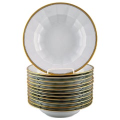 Royal Copenhagen, Twelve Deep Plates in Porcelain with Gold Border