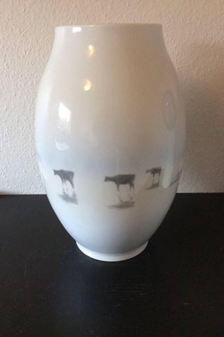 Royal Copenhagen unique vase by Karl Sørensen from 1926 with motif of man with boat and cows.

Measures: 48.5 cm / 19 1/10 inches.

In perfect condition.
 