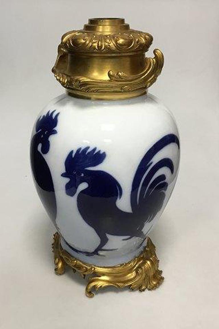 Royal Copenhagen unique vase from 1899 by Vilhelm Fischer Unique number 7054 Russian Zar Family.

Measures: H. (without top mount): 40.3 cm (16 in)
H. (with top mount): 45 cm (17 3/4 in)

Is made as an oil lamp, see picture. Can be dismounted