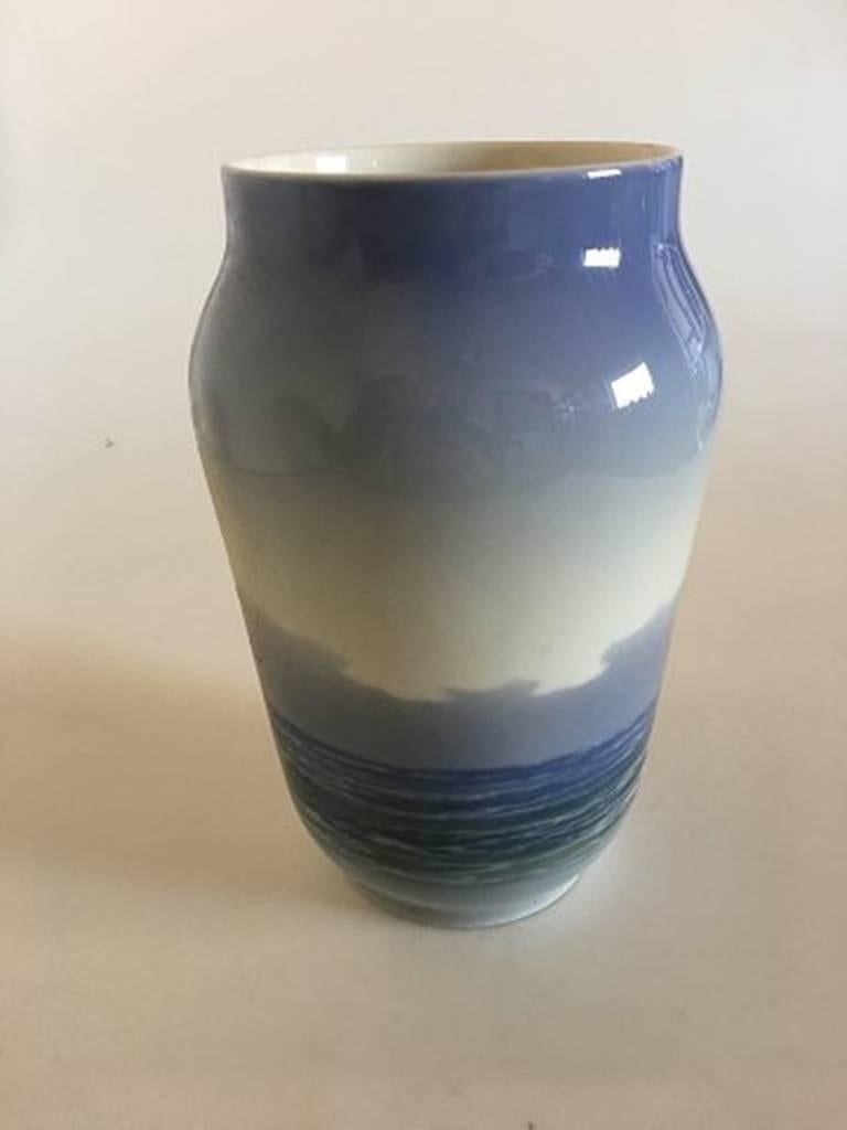 Royal Copenhagen vase #2842/3604 with ship and ocean motif. Measure: 21.5 cm H (8 15/32 in). 1st quality in nice and whole condition.